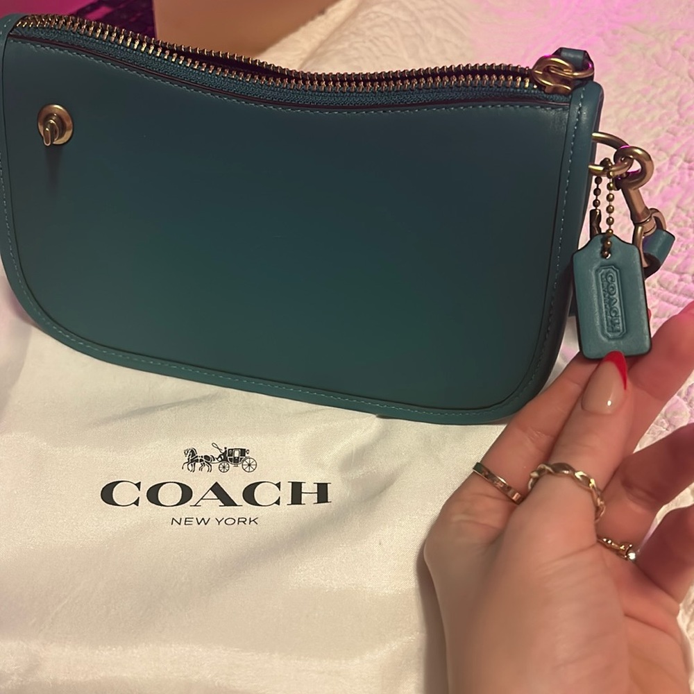 swinger coach purse